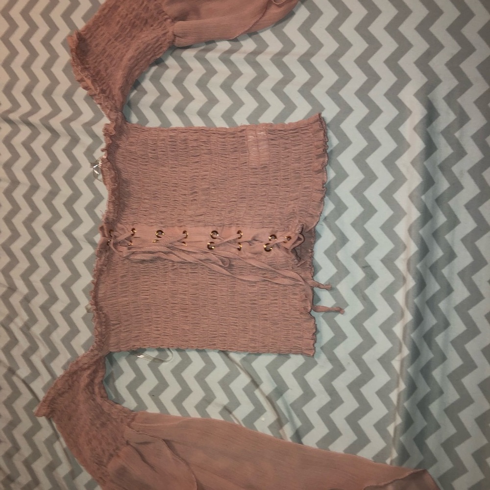 Adorable strapless, loose sleeve lace up shirt